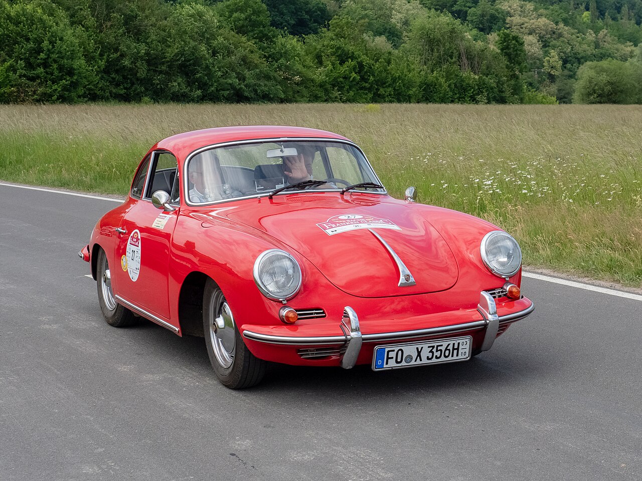 Red Porsche 356 on a country road